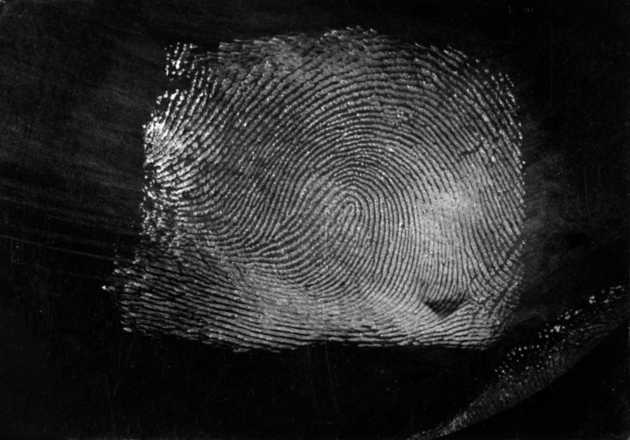 Black foil with lifted fingerprint. image
